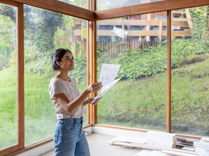 home designer looking at plans