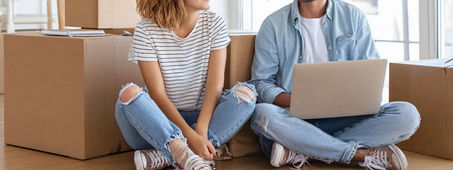 man and women sitting on floor